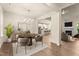 Bright dining area featuring hardwood floors, a modern chandelier, and seamless flow into the living spaces at 65 Stream View Way, Spring Hope, NC 27882