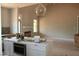 Open concept kitchen featuring a center island and view of an adjacent living area at 65 Stream View Way, Spring Hope, NC 27882