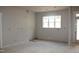 Bright living room with large windows and a view of the backyard at 65 Stream View Way, Spring Hope, NC 27882