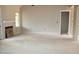 Spacious living room with vaulted ceiling, fireplace, and large windows at 65 Stream View Way, Spring Hope, NC 27882
