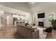 Inviting living room with vaulted ceiling, fireplace, and open-concept layout to the kitchen and staircase at 65 Stream View Way, Spring Hope, NC 27882
