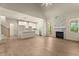 Open-concept living area featuring a fireplace, modern kitchen, and access to the outdoor space at 65 Stream View Way, Spring Hope, NC 27882