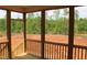 View from screened porch overlooks the lush backyard at 65 Stream View Way, Spring Hope, NC 27882
