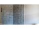 Modern tiled shower featuring gray tiling at 65 Stream View Way, Spring Hope, NC 27882