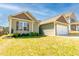 A charming single-story home with a manicured lawn and attached garage in a suburban neighborhood at 6808 Lakinsville Ln, Raleigh, NC 27610