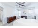 Spacious main bedroom with ceiling fan, dual windows, and modern furniture at 6808 Lakinsville Ln, Raleigh, NC 27610