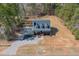 Aerial view of the home showing the lawn, driveway, and house at 692 Port Dr, Henderson, NC 27537