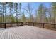 Wooden back deck overlooking wooded backyard at 692 Port Dr, Henderson, NC 27537