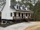 Gorgeous craftsman-style home with dark trim windows and a manicured lawn at 692 Port Dr, Henderson, NC 27537
