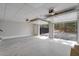 Open garage with concrete floors and open garage door to the gravel driveway at 692 Port Dr, Henderson, NC 27537