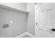 Laundry room features neutral walls, white trim, and light colored floors at 692 Port Dr, Henderson, NC 27537