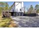 A full rear view highlighting the walkout basement and deck at 692 Port Dr, Henderson, NC 27537