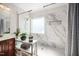 Elegant bathroom with a glass shower, marble accent wall, and a modern sink and vanity at 706 Oldwyck Dr, Fuquay Varina, NC 27526