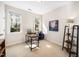 Bright bedroom featuring a desk, a modern computer setup, and well-lit natural light at 706 Oldwyck Dr, Fuquay Varina, NC 27526