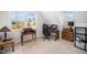 A charming bedroom with neutral colors, large windows, and wooden desks at 706 Oldwyck Dr, Fuquay Varina, NC 27526