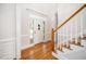 Elegant foyer featuring hardwood floors, a staircase, and a bright, welcoming entrance at 706 Oldwyck Dr, Fuquay Varina, NC 27526