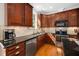 Well-lit kitchen showcasing granite countertops, tiled backsplash, stainless steel appliances, and ample cabinet space at 706 Oldwyck Dr, Fuquay Varina, NC 27526
