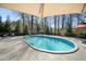 Backyard featuring an in-ground pool, wooden deck, and mature trees at 706 Oldwyck Dr, Fuquay Varina, NC 27526