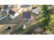 A house with a shed and trampoline situated on a large lot in a neighborhood at 75 Red Crabapple Ct, Clayton, NC 27520