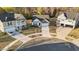 Aerial view of suburban homes with well-manicured lawns at 75 Red Crabapple Ct, Clayton, NC 27520