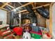Attic with exposed rafters, ductwork, and assorted storage bins at 75 Red Crabapple Ct, Clayton, NC 27520