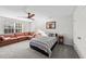 Cozy bedroom features a sitting area, ceiling fan, and plush carpeting at 75 Red Crabapple Ct, Clayton, NC 27520