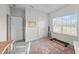 Cozy bedroom featuring a large window, a map of the USA, and ample closet space at 75 Red Crabapple Ct, Clayton, NC 27520