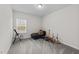 Minimalist bedroom with a window, a chaise lounge, and decorative items at 75 Red Crabapple Ct, Clayton, NC 27520