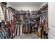 Walk-in closet with extensive shelving, hanging racks, and storage space for clothes, shoes, and accessories at 75 Red Crabapple Ct, Clayton, NC 27520