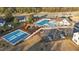 An aerial view of neighborhood amenities including a pool, tennis court, and playground at 75 Red Crabapple Ct, Clayton, NC 27520