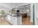 Open-concept kitchen flows into the living area with a central island, perfect for modern living at 75 Red Crabapple Ct, Clayton, NC 27520