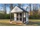 Charming shed with decorative star and functional double doors at 75 Red Crabapple Ct, Clayton, NC 27520
