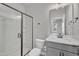 Stylish bathroom with a glass-enclosed shower, a sleek vanity, and modern fixtures at 818 Lilyquist Way, Wake Forest, NC 27587