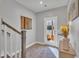 Light-filled entryway offering access to a serene outdoor lake view from the main level of the home at 818 Lilyquist Way, Wake Forest, NC 27587