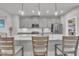 Contemporary kitchen featuring a marble island, stainless appliances, and gray cabinets with ample storage at 818 Lilyquist Way, Wake Forest, NC 27587