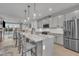 Bright, airy kitchen boasts a large island with seating, stainless steel appliances, and an open layout at 818 Lilyquist Way, Wake Forest, NC 27587