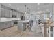 Open-concept kitchen featuring a large island with seating and modern stainless steel appliances at 818 Lilyquist Way, Wake Forest, NC 27587