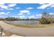 Scenic walking path along a calm lake surrounded by lush greenery and residential area at 818 Lilyquist Way, Wake Forest, NC 27587