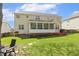 Lovely home exterior with a screened porch, a wooden deck, and a beautifully landscaped yard at 8215 Cushing St, Raleigh, NC 27613