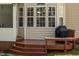 Cozy outdoor deck area with covered windows, offering a comfortable and private space at 8215 Cushing St, Raleigh, NC 27613