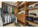 Walk-in closet with custom shelving and hanging racks for organization at 8215 Cushing St, Raleigh, NC 27613