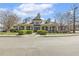 Elegant community clubhouse with well-manicured landscaping and classic architectural details at 8215 Cushing St, Raleigh, NC 27613