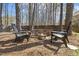 Inviting backyard fire pit area with comfortable seating, ideal for gatherings at 8215 Cushing St, Raleigh, NC 27613
