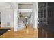 Elegant foyer with hardwood floors, a staircase with rod iron spindles, and high ceilings at 8215 Cushing St, Raleigh, NC 27613