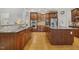 Spacious kitchen featuring wood cabinets, stainless steel appliances, and granite countertops at 8215 Cushing St, Raleigh, NC 27613