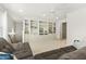 Large living room boasts built-in bookcases, a cozy sofa, and lots of natural light at 8215 Cushing St, Raleigh, NC 27613