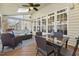 Inviting sunroom complete with skylight, ceiling fan, and outdoor views at 8215 Cushing St, Raleigh, NC 27613