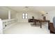Spacious home office area with built in shelving, large window, and a ceiling fan at 8310 Wycombe Ln, Raleigh, NC 27615