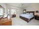 A large, carpeted main bedroom features a bay window, neutral tones, and is brightly lit by natural light at 8310 Wycombe Ln, Raleigh, NC 27615
