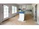 Bright kitchen with a center island, sleek countertops, and modern appliances at 835 Emmett Ct, Spring Hope, NC 27882